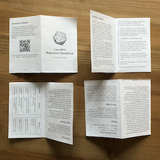 The image shows four views of a small folded zine-style booklet titled *Law RPG Beginner’s Handbook* by David Colarusso, laid flat on a wooden surface. Each booklet page is visible, arranged to display its contents. The front cover includes a 20-sided die illustration and a subtitle. Inside pages feature game instructions, sample dialogue mimicking courtroom scenes (labeled “JUDGE” and “ATTORNEY”), rules on ability checks, case sheets, roles, and a QR code linking to an interactive helper. One section breaks down missions, objectives, and outcomes in a tabular format, suggesting a tabletop RPG-style gameplay experience themed around courtroom law. The booklet appears to be an educational take on combining role-playing mechanics with legal procedures.